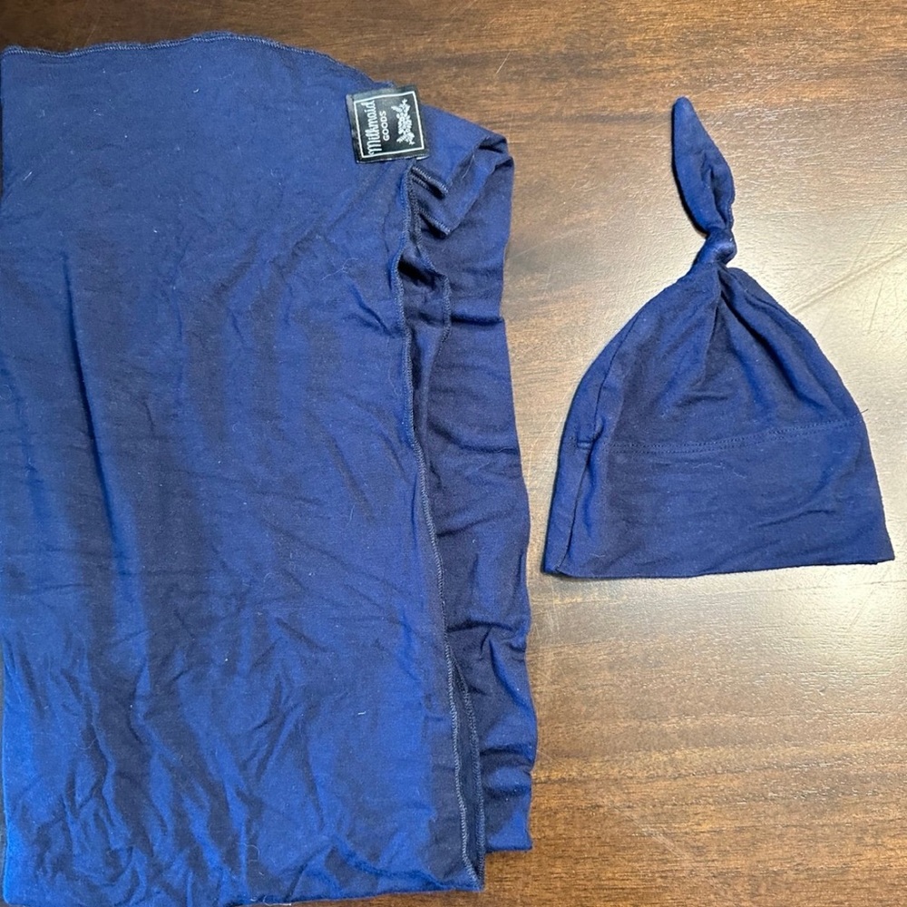 Milkmaid Goods Swaddle & Hat Set matching navy blue for newborns.